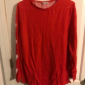 Red sweater with hearts on sleeves